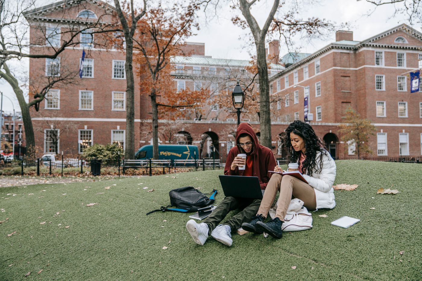 College students studying together outdoors on campus
